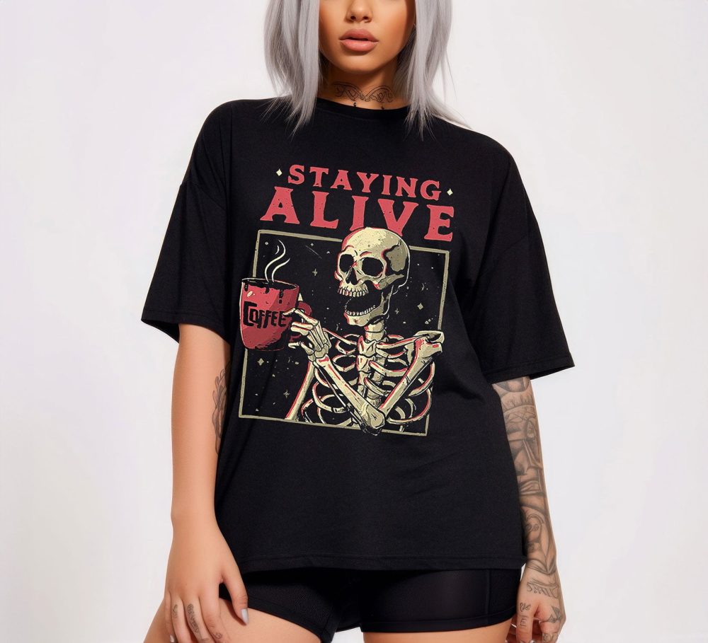 Embrace Halloween Haunts with The Staying Alive Coffee Lovers Funny Skeleton Shirt